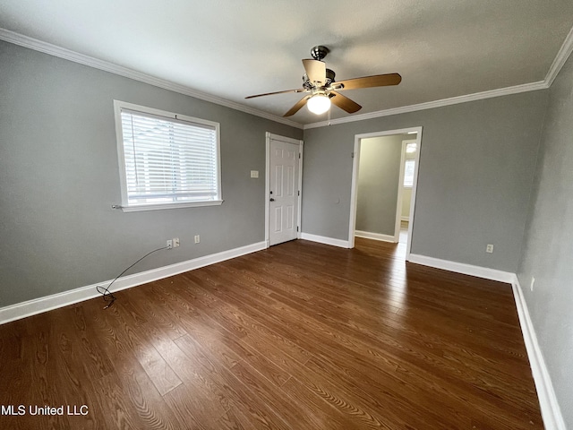 unfurnished room with dark wood-type flooring, ceiling fan, and ornamental molding