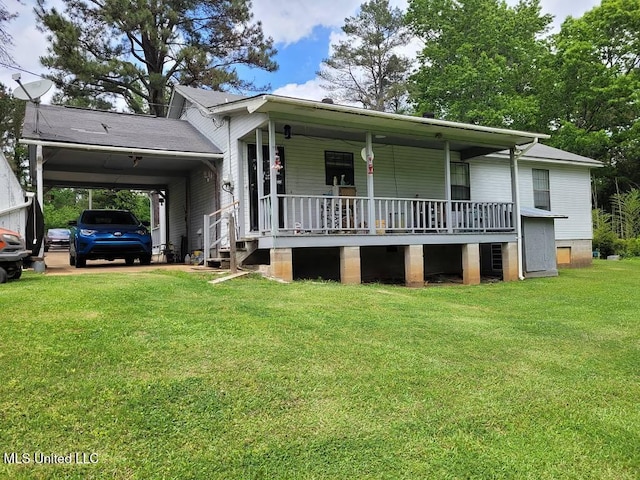 view of front of house featuring a carport, a porch, and a front yard