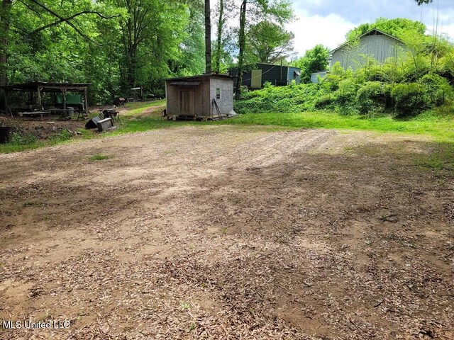 3189 S Red Banks Rd, Byhalia, MS 38611 - view of yard featuring a storage shed and an outbuilding