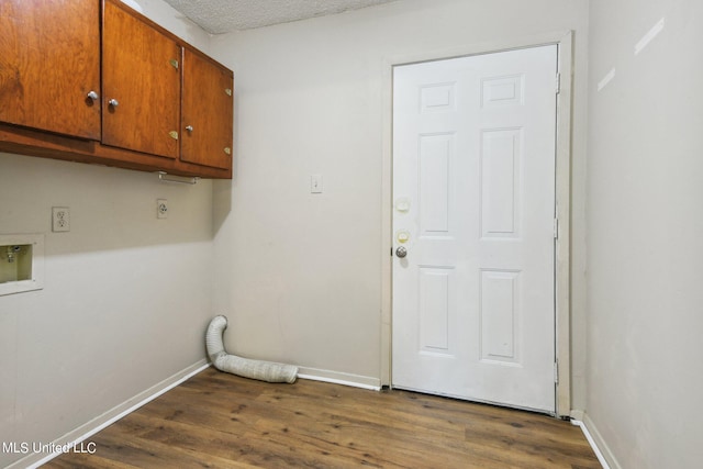 laundry area with cabinets, washer hookup, dark hardwood / wood-style flooring, a textured ceiling, and hookup for an electric dryer