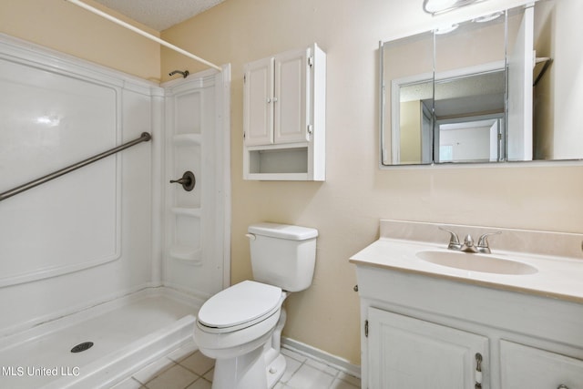 bathroom featuring a textured ceiling, walk in shower, toilet, vanity, and tile patterned flooring