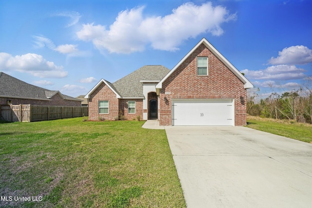 traditional-style home with fence, roof with shingles, a front lawn, concrete driveway, and brick siding