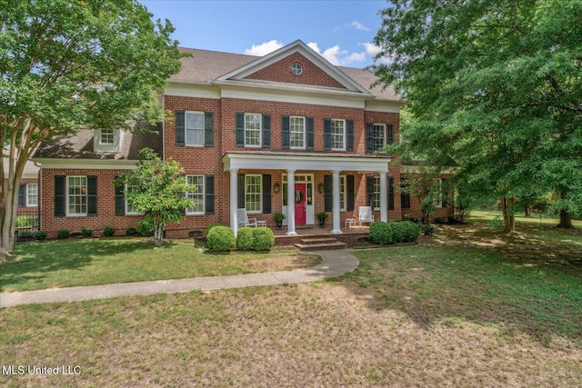 5264 Chappel Cv, Olive Branch, MS 38654 - colonial house featuring a porch, brick siding, and a front yard
