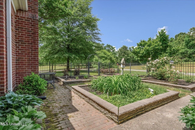 5264 Chappel Cv, Olive Branch, MS 38654 - view of yard with fence, a garden, and view of scattered trees