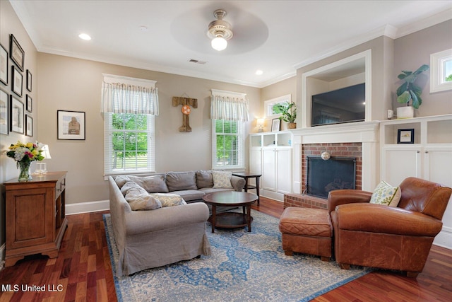 5264 Chappel Cv, Olive Branch, MS 38654 - living area with a brick fireplace, dark wood finished floors, ceiling fan, ornamental molding, and recessed lighting