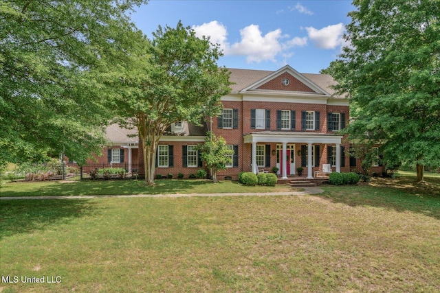 5264 Chappel Cv, Olive Branch, MS 38654 - colonial-style house featuring covered porch, brick siding, and a front yard