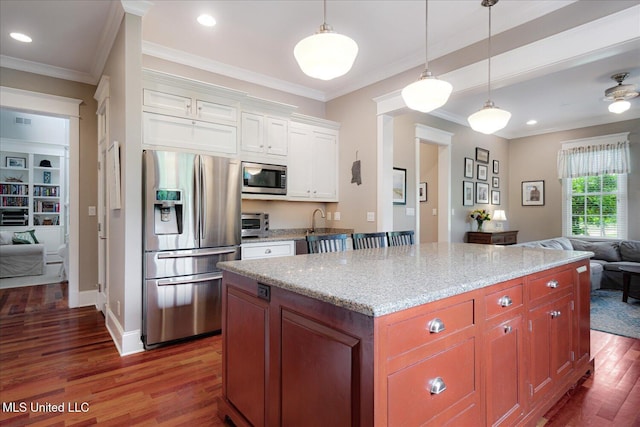 5264 Chappel Cv, Olive Branch, MS 38654 - kitchen with stainless steel appliances, open floor plan, dark wood-type flooring, light stone countertops, and white cabinets