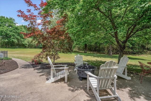 5264 Chappel Cv, Olive Branch, MS 38654 - view of patio / terrace with a fire pit, central air condition unit, and view of wooded area