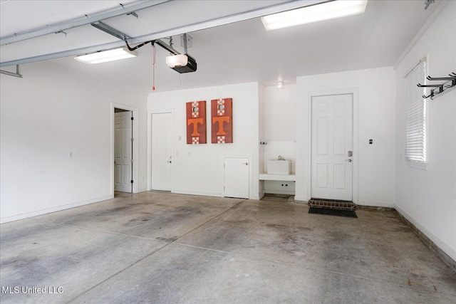 5264 Chappel Cv, Olive Branch, MS 38654 - garage with a garage door opener and baseboards