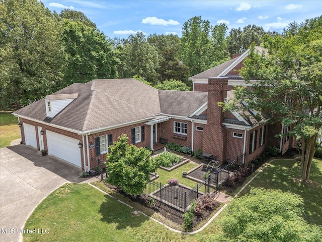5264 Chappel Cv, Olive Branch, MS 38654 - view of front facade with driveway, brick siding, a shingled roof, and a garage