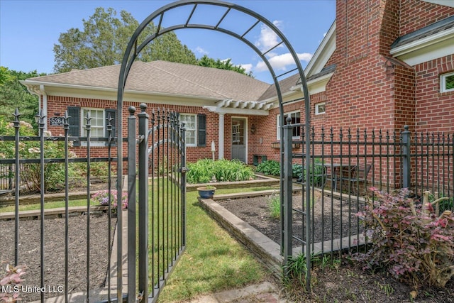 5264 Chappel Cv, Olive Branch, MS 38654 - view of front of house featuring brick siding, fence, a gate, and roof with shingles