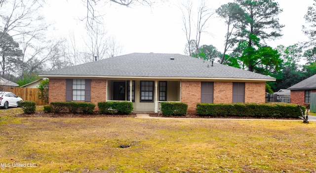 ranch-style home featuring a front yard