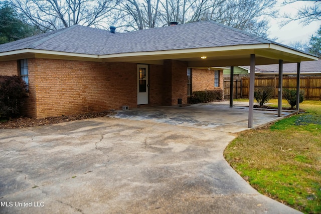 exterior space featuring a carport