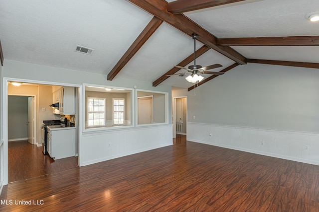 unfurnished living room featuring lofted ceiling with beams, dark hardwood / wood-style floors, a textured ceiling, and ceiling fan