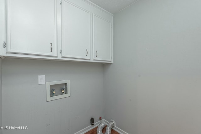 laundry area with cabinets, hookup for a gas dryer, and hookup for a washing machine