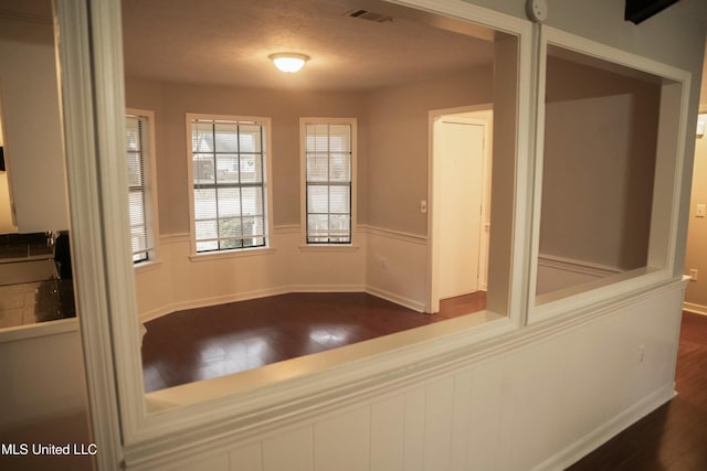 interior space with dark hardwood / wood-style flooring