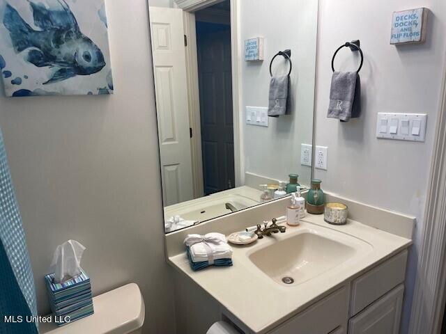 bathroom with vanity and toilet