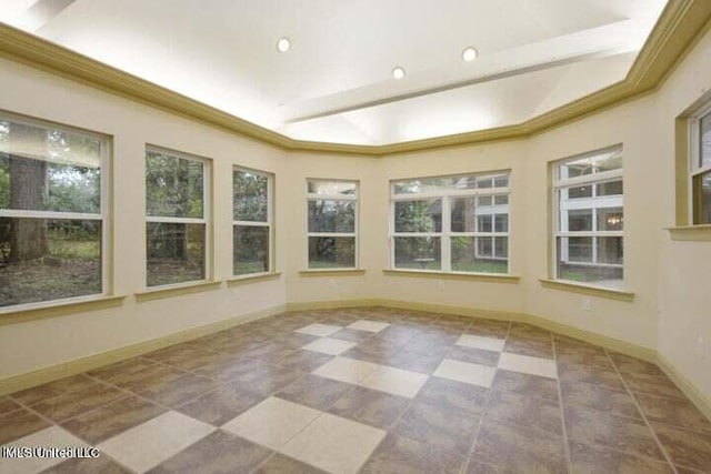 unfurnished sunroom featuring a raised ceiling