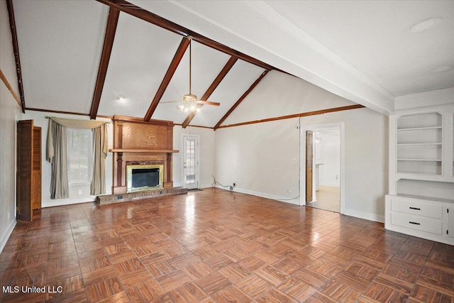 5123 Forest Hill Rd, Byram, MS 39272 - unfurnished living room featuring baseboards, a ceiling fan, a fireplace, beam ceiling, and high vaulted ceiling