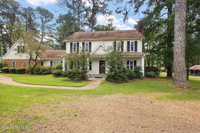 5123 Forest Hill Rd, Byram, MS 39272 - view of front of house featuring a chimney, a front lawn, and covered porch