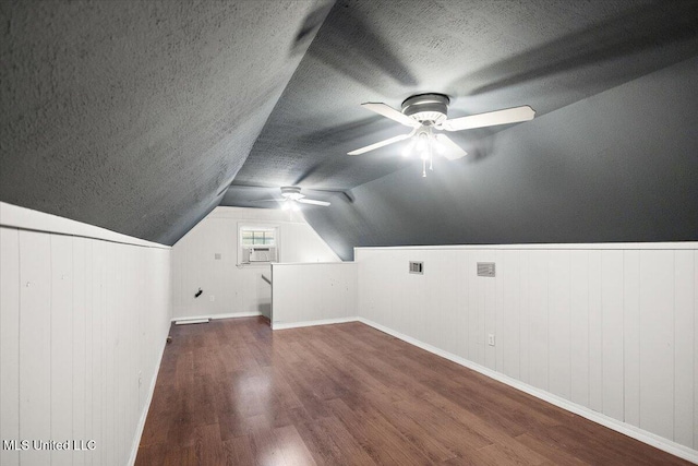 5123 Forest Hill Rd, Byram, MS 39272 - additional living space featuring wood finished floors, ceiling fan, baseboards, a textured ceiling, and vaulted ceiling