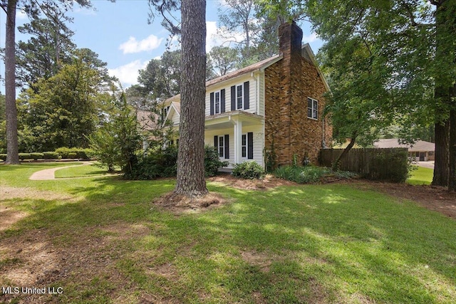 5123 Forest Hill Rd, Byram, MS 39272 - view of home's exterior with a chimney and a yard