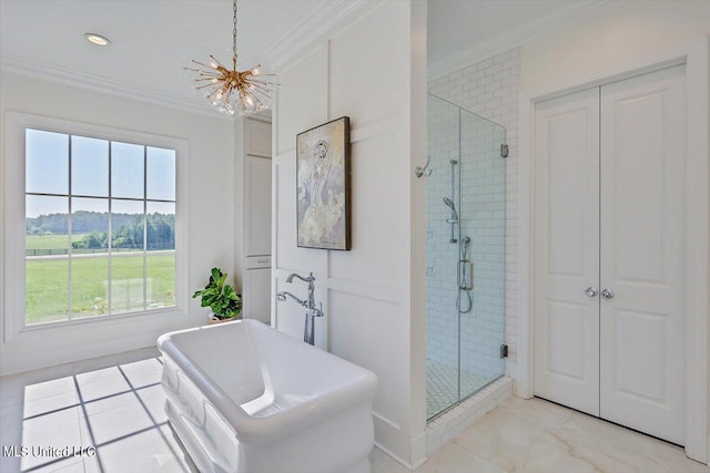 bathroom with a notable chandelier, ornamental molding, and separate shower and tub