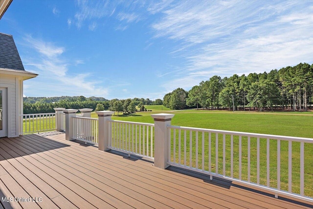 wooden terrace with a lawn