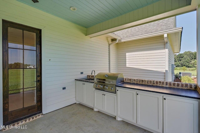 view of patio / terrace featuring area for grilling and sink