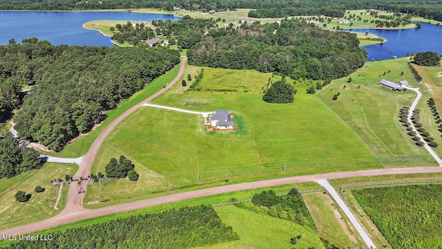 drone / aerial view featuring a water view and a rural view