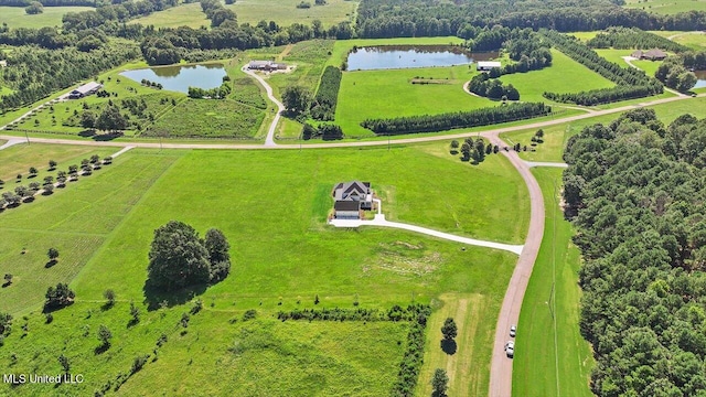 birds eye view of property with a water view and a rural view