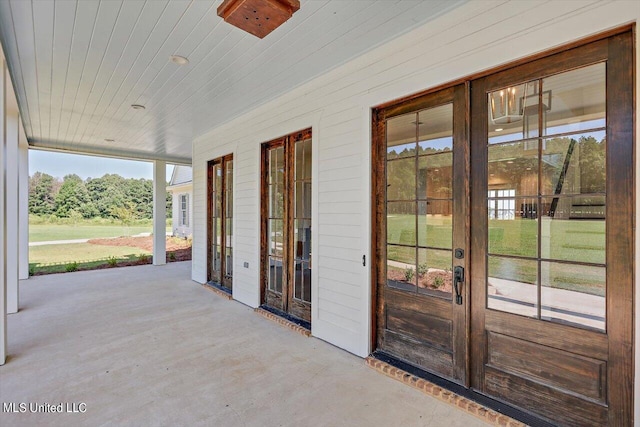 exterior space with wooden ceiling and a wealth of natural light