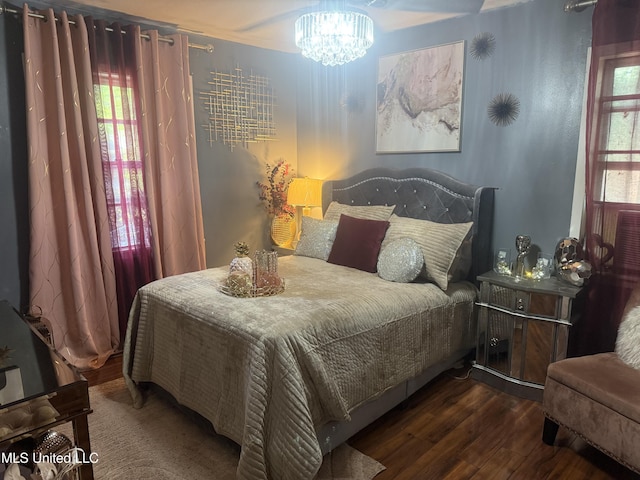 434 Boehle St, Pearl, MS 39208 - bedroom featuring wood finished floors and a chandelier