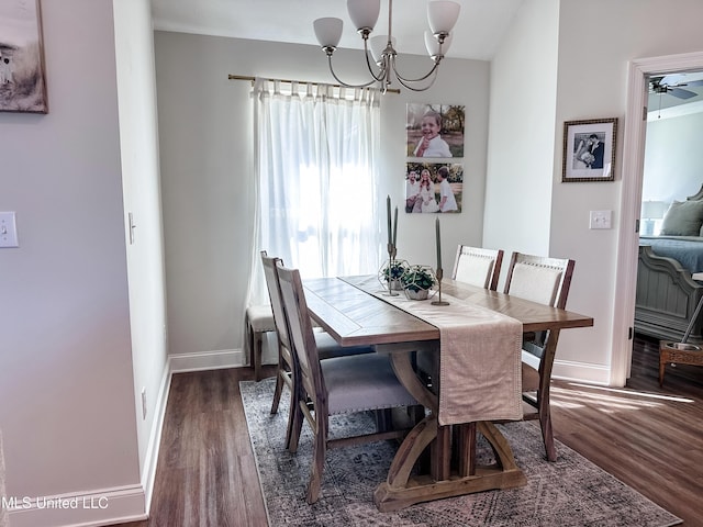 dining area with an inviting chandelier, baseboards, and wood finished floors