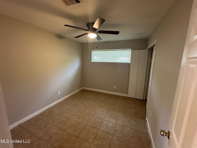 365 Gatewood Dr, Pearl, MS 39208 - empty room with a ceiling fan, light tile patterned floors, and baseboards