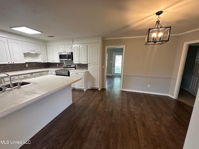 365 Gatewood Dr, Pearl, MS 39208 - kitchen with stainless steel appliances, a sink, dark wood-style flooring, white cabinetry, and tile counters