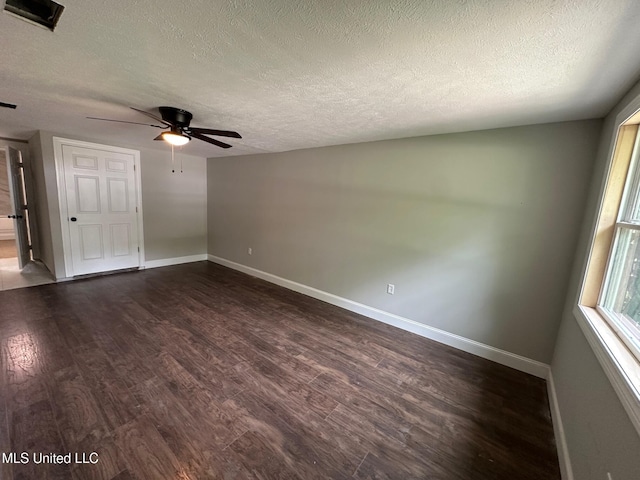 365 Gatewood Dr, Pearl, MS 39208 - spare room with ceiling fan, dark wood finished floors, baseboards, and a textured ceiling