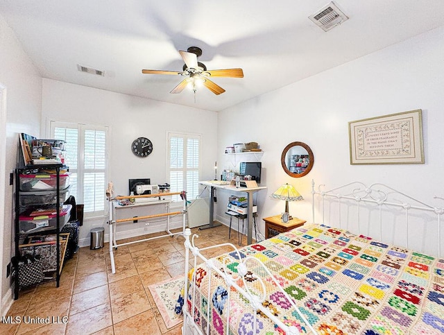 bedroom featuring baseboards, visible vents, and a ceiling fan