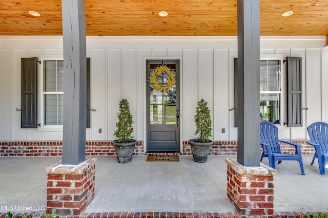 150 Pine Ridge Cir, Brandon, MS 39047 - view of exterior entry featuring board and batten siding and covered porch