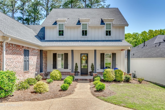 150 Pine Ridge Cir, Brandon, MS 39047 - view of front of house featuring brick siding, roof with shingles, a porch, and board and batten siding