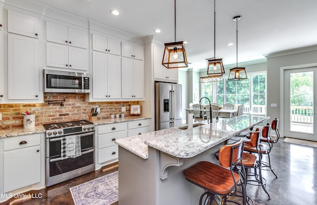 150 Pine Ridge Cir, Brandon, MS 39047 - kitchen featuring concrete flooring, tasteful backsplash, stainless steel appliances, and a sink