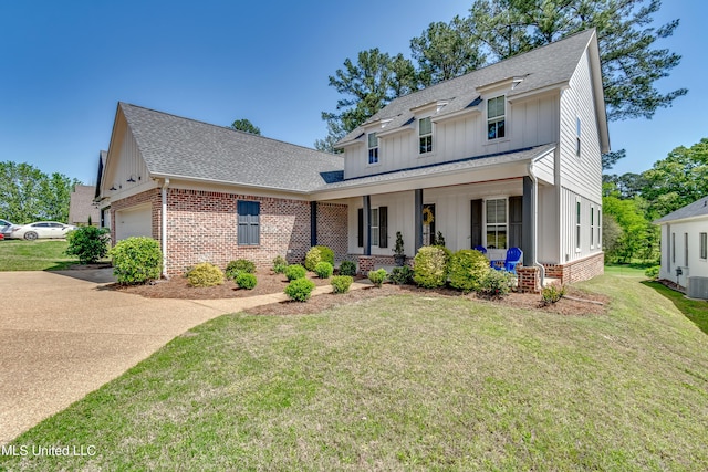 150 Pine Ridge Cir, Brandon, MS 39047 - modern inspired farmhouse featuring a shingled roof, board and batten siding, an attached garage, covered porch, and brick siding