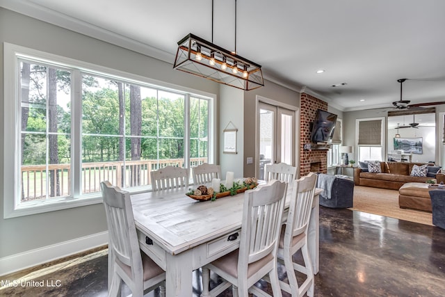 150 Pine Ridge Cir, Brandon, MS 39047 - dining area with plenty of natural light, a ceiling fan, and crown molding
