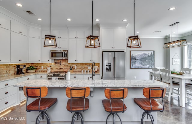 150 Pine Ridge Cir, Brandon, MS 39047 - kitchen featuring concrete floors, appliances with stainless steel finishes, tasteful backsplash, and white cabinetry