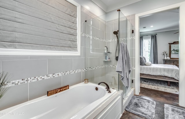 150 Pine Ridge Cir, Brandon, MS 39047 - bathroom with finished concrete flooring, ensuite bath, a garden tub, and a stall shower