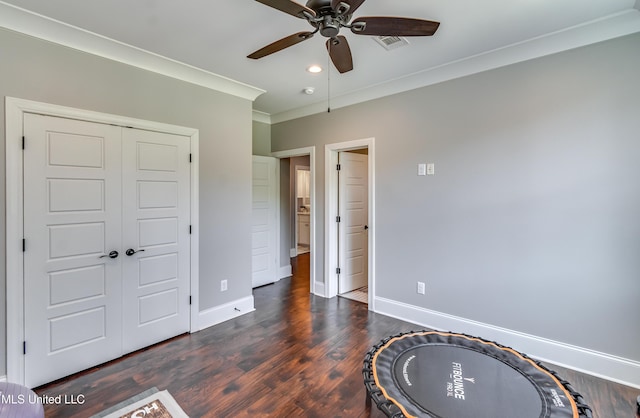 150 Pine Ridge Cir, Brandon, MS 39047 - bedroom featuring dark wood-style flooring, visible vents, baseboards, a closet, and crown molding