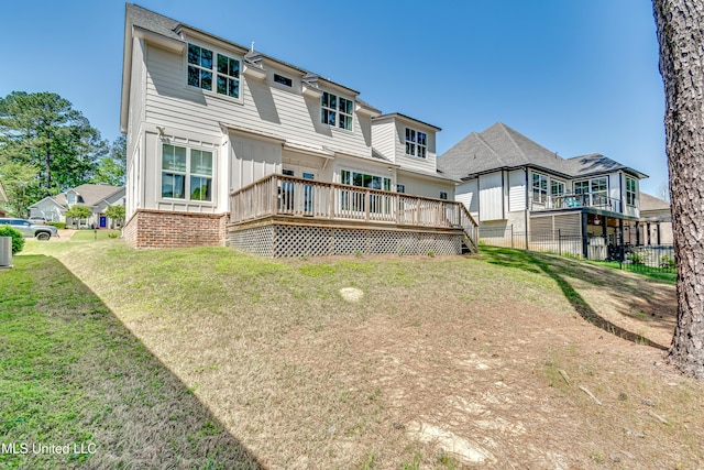 150 Pine Ridge Cir, Brandon, MS 39047 - back of property with fence, a wooden deck, board and batten siding, and a yard