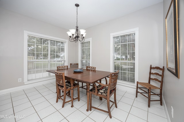 tiled dining area with a notable chandelier