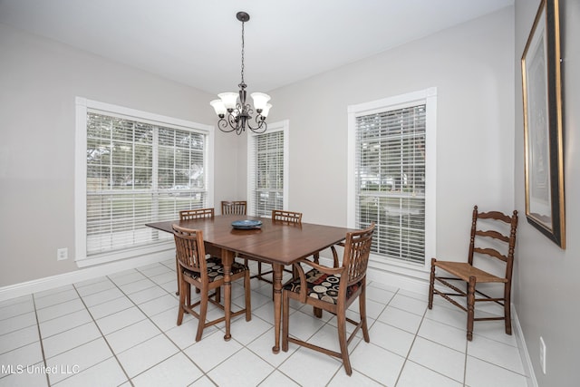 3607 Dijon Ave, Ocean Springs, MS 39564 - dining area with a chandelier, light tile patterned flooring, and baseboards