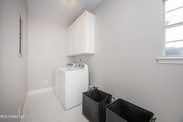 washroom featuring cabinets and independent washer and dryer